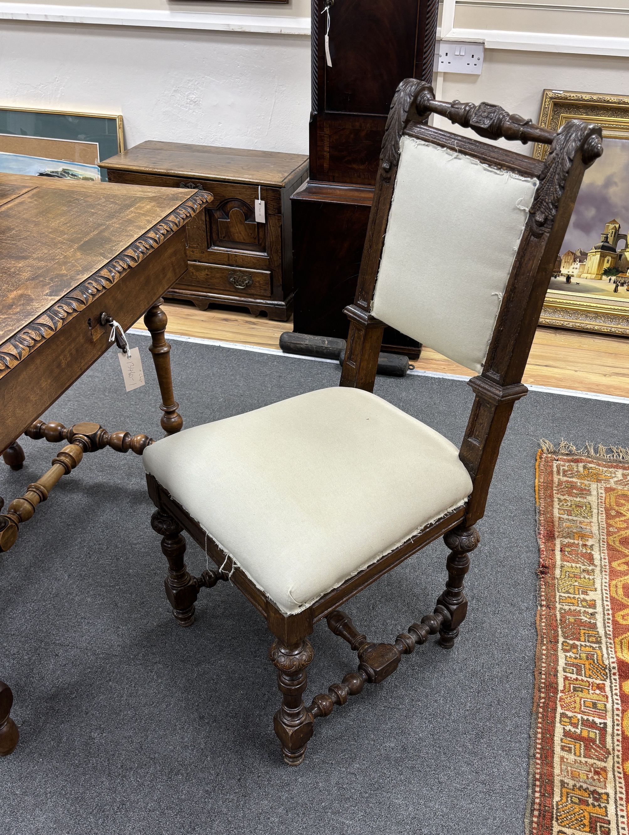 A 19th century Continental walnut side table and Flemish oak chair, table width 99cm, depth 65cm, height 71cm